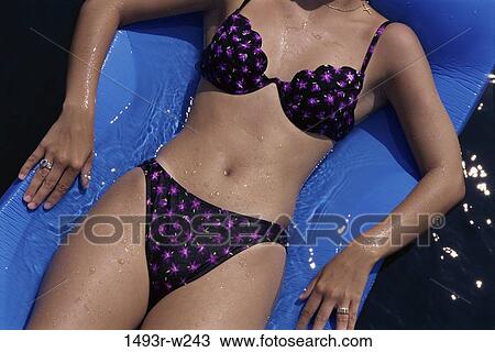 Stock Image - people, floating, water, pool, woman, beach. Fotosearch