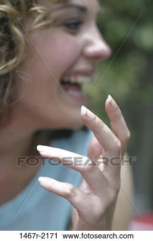 people, hand, woman, talking, excitement, laughing, outdoors View Large Photo Image Stock Image - people, hand, woman, talking, excitement, laughing, outdoors. Fotosearch