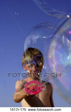 people, playing, bubbles, boy, outdoors, blowing, child View Large Photo Image Stock Photography - people, playing, bubbles, boy, outdoors, blowing, child. Fotosearch