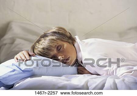 Stock Photo - people, sleeping, pillow, bed, resting, tired. Fotosearch