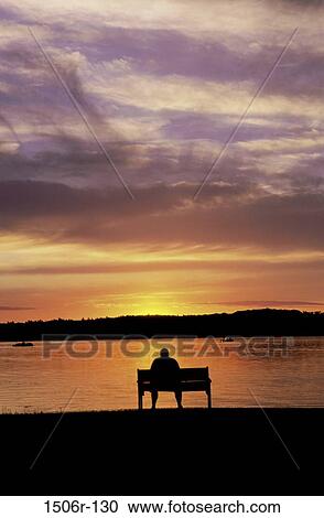 people, water, bench, sitting, sunset, lake, silhouette View Large Photo Image Stock Image - people, water, bench, sitting, sunset, lake, silhouette. Fotosearch