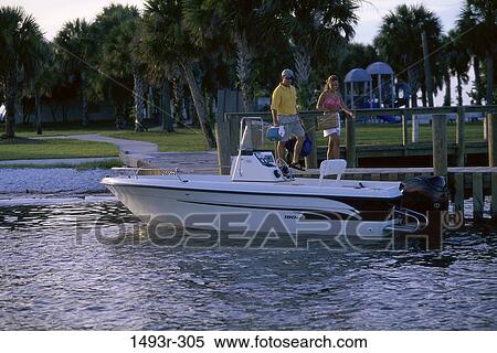 people, water, couple, palm trees, boating, outdoors View Large Photo Image Stock Photography - people, water, couple, palm trees, boating, outdoors. Fotosearch