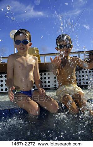 Stock Image - people, water, pool, playing, sitting, beach, splash. Fotosearch