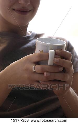 people, woman, Hispanic, mug, drinking, holding, warm View Large Photo Image Stock Image - people, woman, Hispanic, mug, drinking, holding, warm. Fotosearch