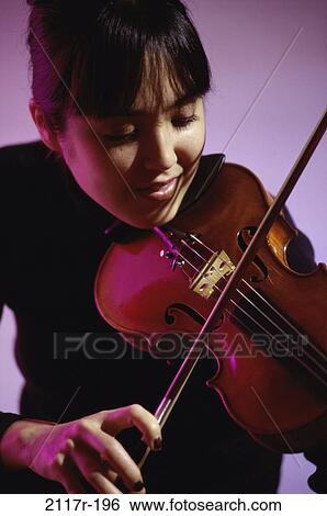 Stock Photograph - people, woman, playing, Asian, music, violin, arts. Fotosearch