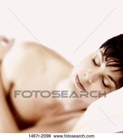 Stock Photo - people, woman, sleeping, resting, peaceful, brunette, asleep. Fotosearch