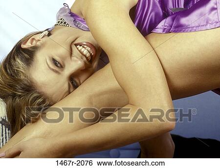 Stock Photograph - people, woman, smiling, bending, smile, blond. Fotosearch