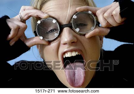 people, woman, tongue, individuality, goggles, blond View Large Photo Image Stock Image - people, woman, tongue, individuality, goggles, blond. Fotosearch