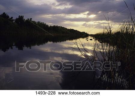 sky, grass, reflection, water, clouds, still View Large Photo Image Stock Photo - sky, grass, reflection, water, clouds, still. Fotosearch