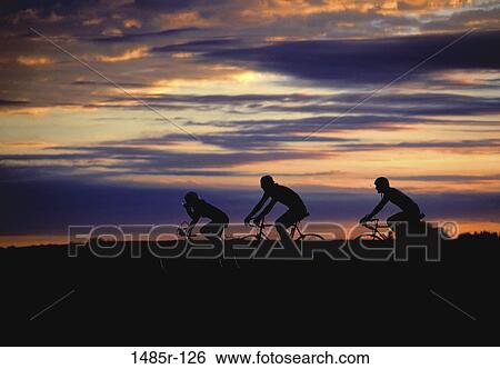 Stock Photograph - sky, people, bicycle, sunset, silhouette, sports. Fotosearch