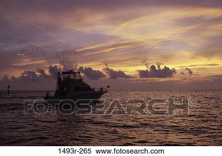 Stock Photography - sky, water, morning, silhouette, boating, boat. Fotosearch