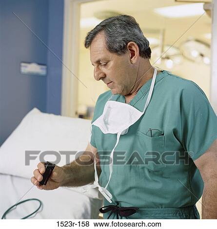 surgery, mask, surgeon, health, Middle-aged, checking View Large Photo Image Stock Photo - surgery, mask, surgeon, health, Middle-aged, checking. Fotosearch