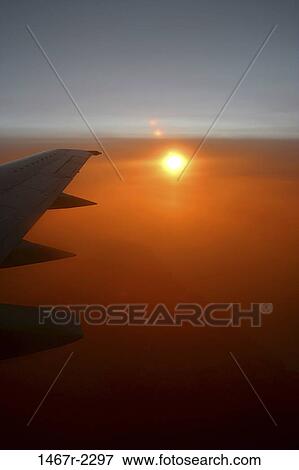 transportation, sun, silhouette, sunset, wing, horizon, airplane View Large Photo Image Stock Photo - transportation, sun, silhouette, sunset, wing, horizon, airplane. Fotosearch