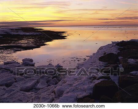 Stock Image - water, sunset, beach, calm, nature, sunrise, Ocean sunset. Fotosearch
