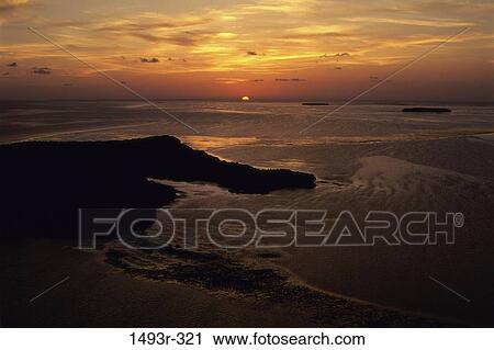 Stock Image - water, sunset, beach, nature, aerial, sunrise. Fotosearch