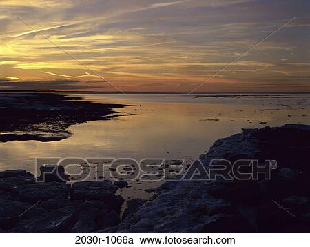 Stock Image - water, sunset, calm, nature, sunrise, Ocean sunset. Fotosearch