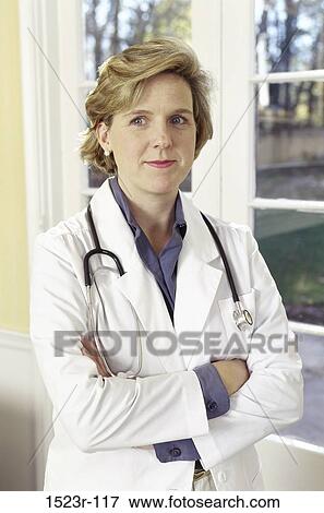 woman, smiling, doctor, stethoscope, health, Middle-aged, smile View Large Photo Image Stock Photo - woman, smiling, doctor, stethoscope, health, Middle-aged, smile. Fotosearch