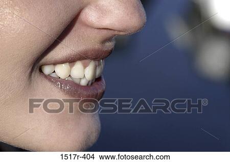 Picture - woman, smiling, profile, teeth, mouth, body parts. Fotosearch