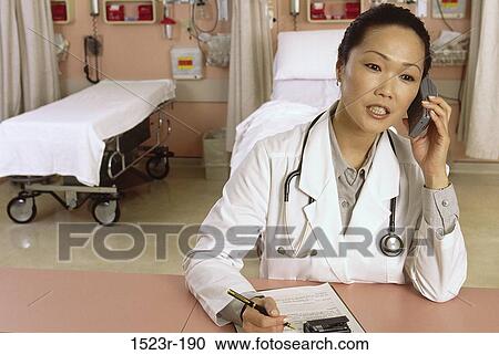 Stock Image - woman, telephone, talking, Asian, conversation, phone. Fotosearch