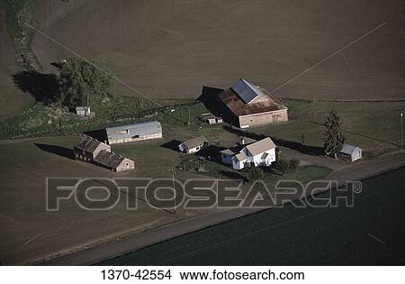 Aerial view of a farmhouse and barns in a field, Palouse, Washington State, USA View Large Photo Image Picture - Aerial view of a farmhouse and barns in a field, Palouse, Washington State, USA. Fotosearch
