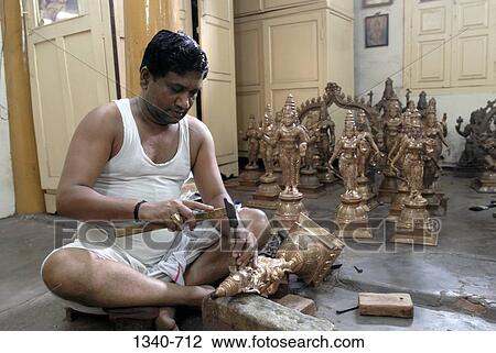 Artisan making bronze sculptures, Swamimalai, Thanjavur, Tamil Nadu, India View Large Photo Image Stock Image - Artisan making bronze sculptures, Swamimalai, Thanjavur, Tamil Nadu, India. Fotosearch