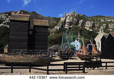 Boats near Net Huts, Hastings Old Town, Hastings, Sussex, England View Large Photo Image Stock Photo - Boats near Net Huts, Hastings Old Town, Hastings, Sussex, England. Fotosearch