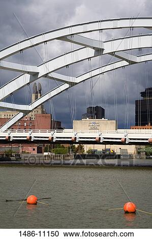 Bridge across a river, Frederick Douglass-Susan B. Anthony Memorial Bridge, Rochester, New York State, USA View Large Photo Image Stock Image - Bridge across a river, Frederick Douglass-Susan B. Anthony Memorial Bridge, Rochester, New York State, USA. Fotosearch