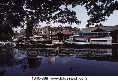 Buildings at the waterfront, Alappuzha, Alappuzha District, Kerala, India View Large Photo Image Stock Photo - Buildings at the waterfront, Alappuzha, Alappuzha District, Kerala, India. Fotosearch