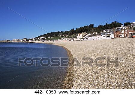 Stock Image - Buildings on the beach, Lyme Regis Beach, Devon, England. Fotosearch