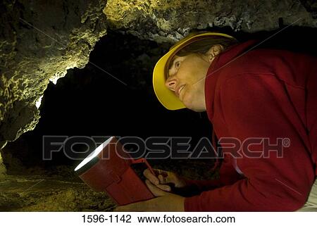 Close-up of a hiker holding a flashlight in a cave, Labyrinth Cave, Lava Beds National Monument, California, USA View Large Photo Image Stock Image - Close-up of a hiker holding a flashlight in a cave, Labyrinth Cave, Lava Beds National Monument, California, USA. Fotosearch