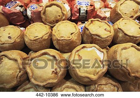 Close-up of pork pies in the display window of a store, Ye Olde Pork Pie Shoppe, Melton Mowbray, Leicestershire, England View Large Photo Image Stock Photograph - Close-up of pork pies in the display window of a store, Ye Olde Pork Pie Shoppe, Melton Mowbray, Leicestershire, England. Fotosearch