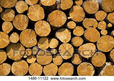 Stock Image - Close-up of stack of logs. Fotosearch