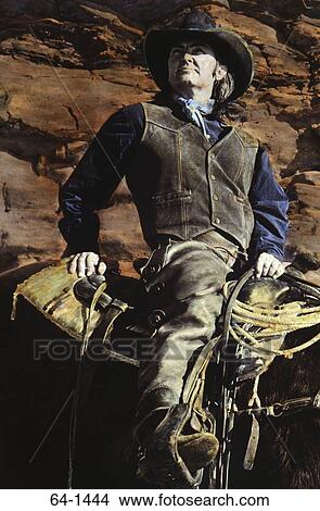 Cowboy riding a horse View Large Photo Image Picture - Cowboy riding a horse. Fotosearch