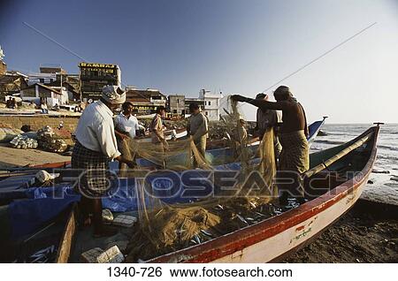 Fishermen standing on boats and holding up nets, Kanyakumari, Tamil Nadu, India View Large Photo Image Stock Photograph - Fishermen standing on boats and holding up nets, Kanyakumari, Tamil Nadu, India. Fotosearch