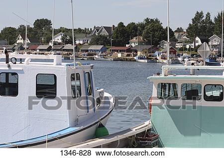Fishing boats docked at a harbor, North Rustico, Prince Edward Island, Canada View Large Photo Image Stock Photo - Fishing boats docked at a harbor, North Rustico, Prince Edward Island, Canada. Fotosearch