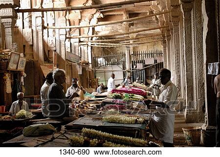 Flowers shops in the corridor of a temple, Sri Meenakshi Hindu Temple, Madurai, Tamil Nadu, India View Large Photo Image Stock Image - Flowers shops in the corridor of a temple, Sri Meenakshi Hindu Temple, Madurai, Tamil Nadu, India. Fotosearch