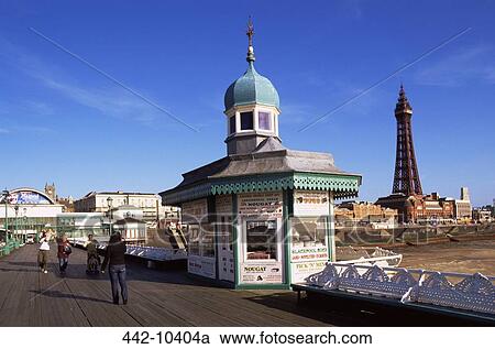 Four people standing near a candy shop, North Pier, Blackpool Tower, Blackpool, Lancashire, England View Large Photo Image Stock Image - Four people standing near a candy shop, North Pier, Blackpool Tower, Blackpool, Lancashire, England. Fotosearch