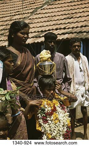 Girl carrying a milk pot on her head, Mariamman Festival, Tamil Nadu, India View Large Photo Image Picture - Girl carrying a milk pot on her head, Mariamman Festival, Tamil Nadu, India. Fotosearch