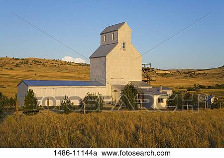 Grain elevator in a field, near Bozeman, Montana, USA View Large Photo Image Stock Image - Grain elevator in a field, near Bozeman, Montana, USA. Fotosearch