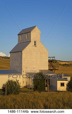 Stock Image - Grain elevator in a field, near Bozeman, Montana, USA. Fotosearch