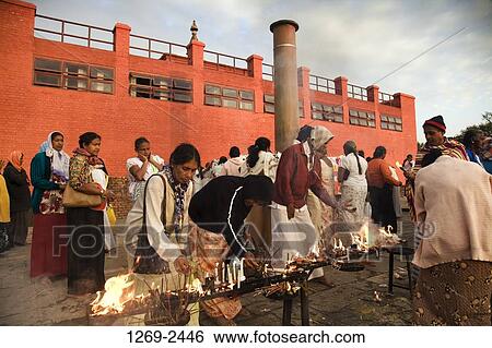 Group of people burning oil lamps and candles at a temple, Ashoka Pillar, Maya Devi Temple, Lumbini, Nepal View Large Photo Image Stock Photograph - Group of people burning oil lamps and candles at a temple, Ashoka Pillar, Maya Devi Temple, Lumbini, Nepal. Fotosearch
