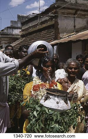 Stock Image - Group of people in a religious procession, Mariamman Festival, Tamil Nadu, India. Fotosearch