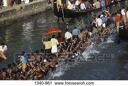 Group of people participating in a traditional snake boat racing, Payippad Boat Race, Payippad Lake, Kerala, India View Large Photo Image Stock Image - Group of people participating in a traditional snake boat racing, Payippad Boat Race, Payippad Lake, Kerala, India. Fotosearch