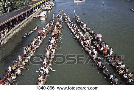 Group of people participating in a traditional snake boat racing, Payippad Boat Race, Payippad Lake, Kerala, India View Large Photo Image Stock Photograph - Group of people participating in a traditional snake boat racing, Payippad Boat Race, Payippad Lake, Kerala, India. Fotosearch