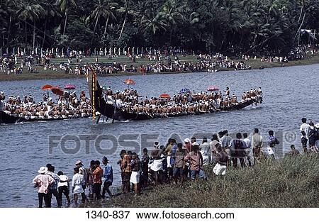 Group of people watching a traditional snake boat racing, Aranmula Boat Race, Pampa River, Aranmula, Kerala, India View Large Photo Image Stock Photo - Group of people watching a traditional snake boat racing, Aranmula Boat Race, Pampa River, Aranmula, Kerala, India. Fotosearch