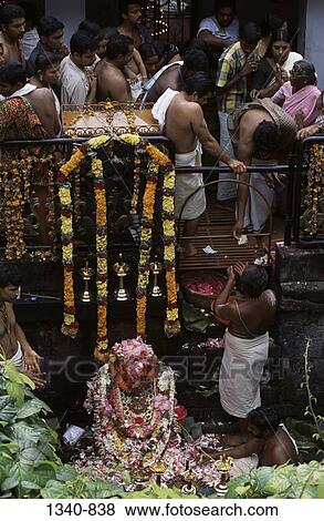 Group of people worshipping in a temple, Panachikkad Saraswati Temple, Kottayam, Kottayam District, Kerala, India View Large Photo Image Stock Photo - Group of people worshipping in a temple, Panachikkad Saraswati Temple, Kottayam, Kottayam District, Kerala, India. Fotosearch