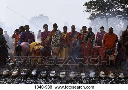 Group of women cooking food in a traditional festival Pongal, Tamil Nadu, India View Large Photo Image Stock Photo - Group of women cooking food in a traditional festival Pongal, Tamil Nadu, India. Fotosearch
