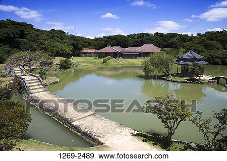 Stock Photo - High angle view of a footbridge across a pond, Shikina-En, Shuri Castle, Naha, Okinawa Prefecture, Japan. Fotosearch