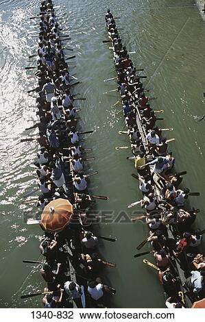 High angle view of a group of people participating in a traditional snake boat racing, Payippad Boat Race, Payippad Lake, Kerala, India View Large Photo Image Stock Image - High angle view of a group of people participating in a traditional snake boat racing, Payippad Boat Race, Payippad Lake, Kerala, India. Fotosearch