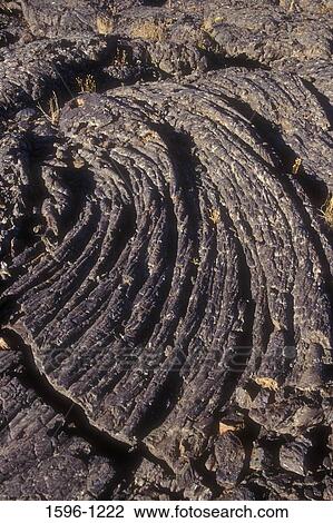 Stock Image - High angle view of frozen lava, Tree Molds area, Craters of the Moon National Monument, Idaho, USA. Fotosearch